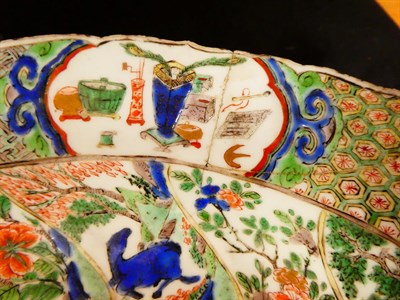 Lot 61 - A Chinese Porcelain Charger, Kangxi, painted in famille verte enamels with foliage within landscape