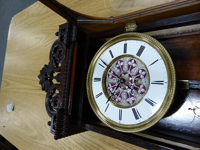 Lot 81 - A Rosewood Vienna Wall Timepiece, circa 1850, scroll pierced pediment, glazed front and side...