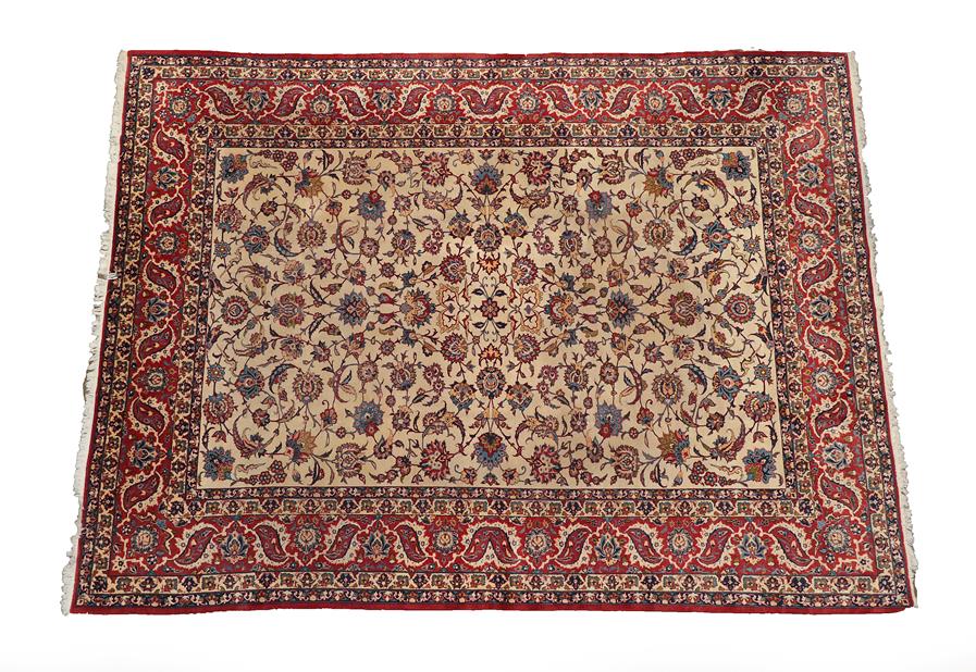Lot 95 - Isfahan Carpet Central Iran, circa 1970 The cream field with an all over design of scrolling...