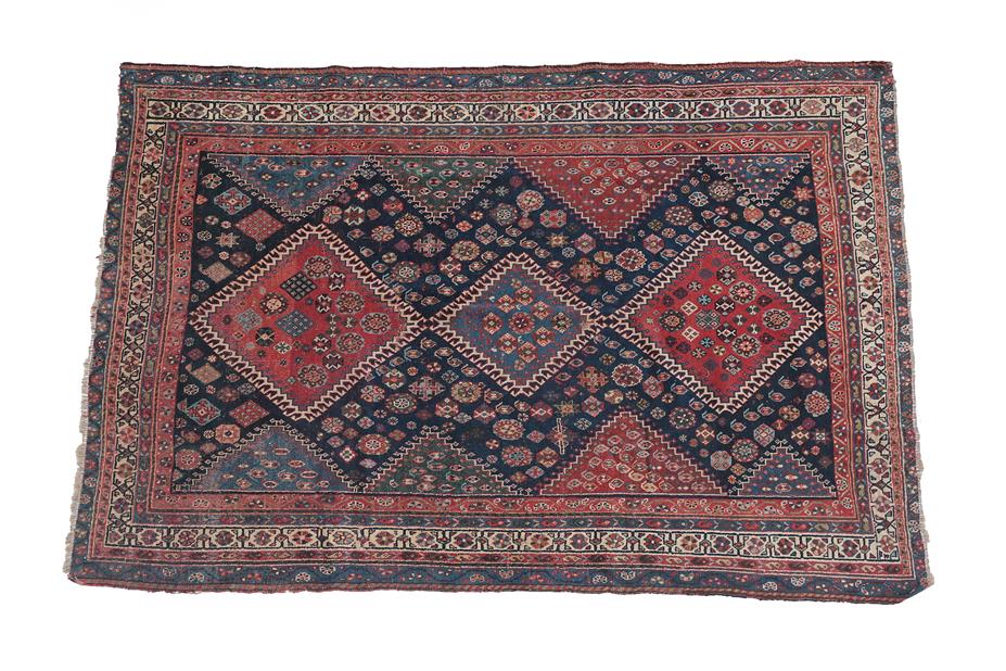 Lot 97 - Kashgai Rug South West Iran, circa 1900 The indigo field of boteh and stylised flower heads...