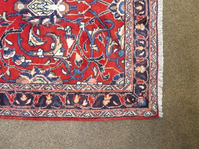Lot 102 - Narrow Saroukh Runner West Iran, circa 1980 The scarlet field of palmettes and scrolling vines...
