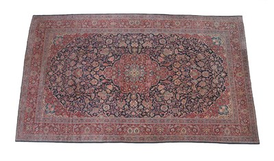 Lot 103 - Fine Large Kashan Carpet Central Iran, circa 1930 The deep indigo field of scrolling vines and...