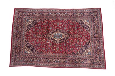 Lot 105 - Kashan Carpet Central Iran, circa 1970 The blood red field of floral vines centred by an indigo...