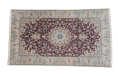 Lot 107 - Nain Part Silk Rug Central Iran, circa 1970 The deep brick red field of scrolling vines around...