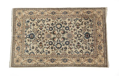 Lot 109 - Kashan Rug Central Iran, circa 1940 The ivory field of vines and flower heads enclosed by...
