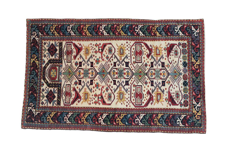 Lot 112 - Shirvan Prayer Rug South East Caucasus, modern The cream field of geometric motifs and angular...