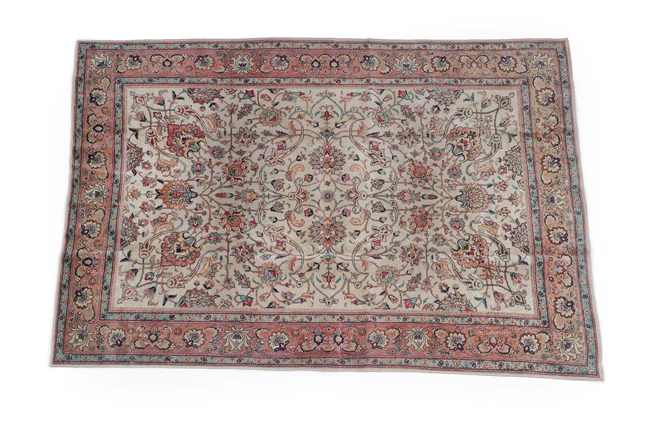 Lot 121 - Tabriz Carpet North West Iran, circa 1950 The ivory field of palmettes and vines enclosed by...
