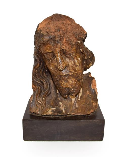 Lot 130 - A Fragmentary Carved and Polychrome Wood Head of Christ, 16th/17th century, with flowing hair...