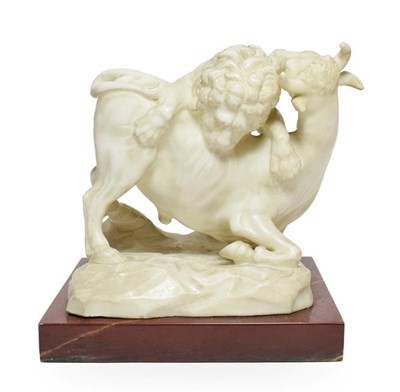 Lot 133 - After Giambologna: A Marble Group of a Lion Attacking a Bull, on a rouge marble base, 22cm wide See