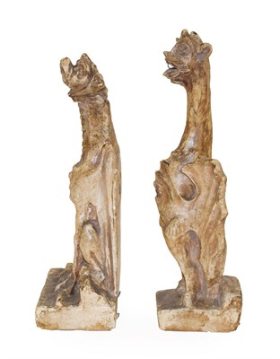 Lot 134 - A Pair of Plaster Figures of Grotesque Animals, in Medieval style, each perched with folded...
