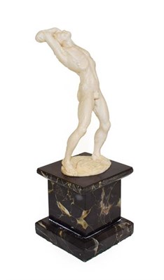 Lot 136 - An Ivory Figure of a Youth, probably German, 1920/30, standing with arched back and arms about...