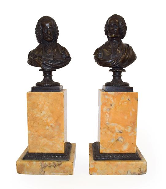 Lot 137 - A Pair of French Bronze Busts of Rousseau and Voltaire, 19th century, on fluted circular socles and