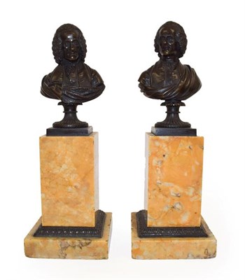 Lot 137 - A Pair of French Bronze Busts of Rousseau and Voltaire, 19th century, on fluted circular socles and