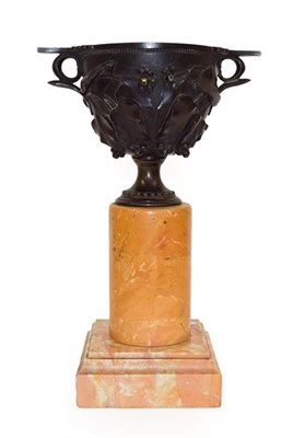Lot 138 - A Bronze Urn, after the Antique, the scroll handles cast with leafy fronds with berries, on a...