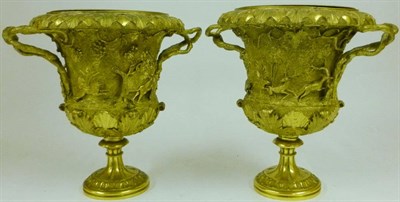 Lot 1065 - After the Antique: A Pair of Gilt Bronze Two-Handled Pedestal Campana Urns, circa 1900, with...