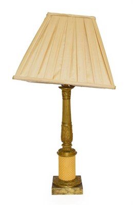 Lot 148 - A Gilt Bronze Table Lamp, in Louis XVI style, of fluted baluster form with leaf sheathed...