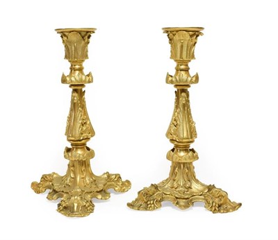 Lot 150 - A Pair of French Gilt Bronze Candlesticks, in Rococo style, with acanthus leaf sheathed...