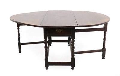 Lot 170 - An Early 18th Century Six-to-Eight-Seater Oak Gateleg Dining Table, with two rounded dropleaves...
