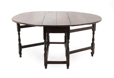 Lot 175 - An Early 18th Century Six-Seater Oak Gateleg Table, with two drop leaves to form an oval, on...