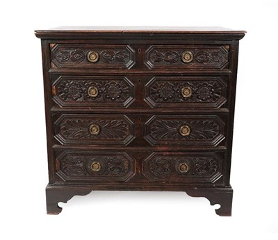 Lot 177 - A 17th Century Oak Straight Front Chest of Drawers, the moulded top above four geometric...