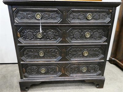 Lot 177 - A 17th Century Oak Straight Front Chest of Drawers, the moulded top above four geometric...