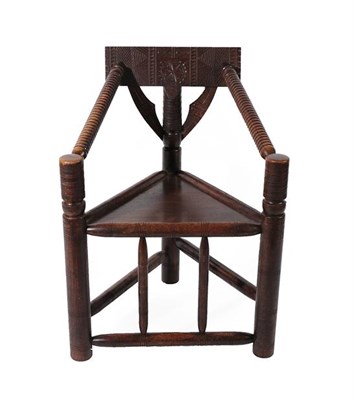 Lot 178 - A 19th Century Oak Turner's Chair, of typical triangular form, the carved back support above turned