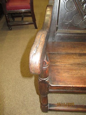 Lot 181 - A 17th Century Joined Oak Wainscot Armchair, later initialled PM and dated 1725, the carved top...