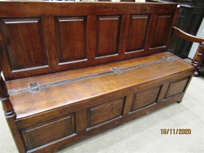 Lot 183 - A George III Joined Oak Settle, late 18th century, the back support with five fielded panels...