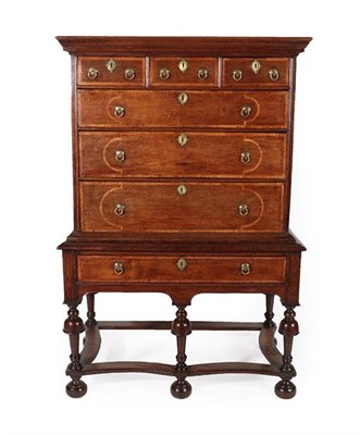 Lot 184 - A Late 17th Century Oak and Feather-Banded Chest on Stand, the bold cornice above three short...