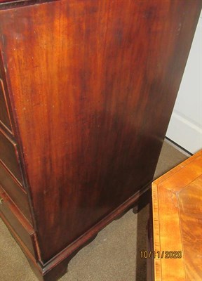 Lot 188 - A George III Mahogany Secretaire Bookcase, late 18th century, the fret carved broken swan neck...