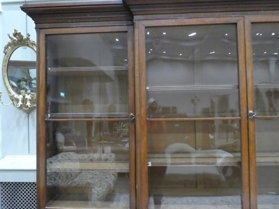 Lot 200 - A Victorian Mahogany Library Bookcase, mid 19th century, the cavetto cornice above four glazed...