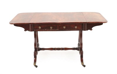 Lot 203 - A George IV Mahogany Sofa Table, early 19th century, the rectangular hinged top above two real...