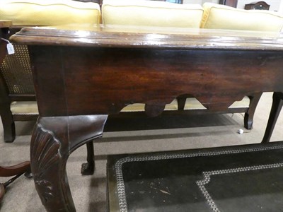 Lot 212 - A George III Irish Carved Mahogany Serving Table, late 18th century, the moulded top above a shaped