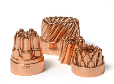 Lot 1072 - A Group of Four Copper Jelly Moulds, late 19th century, comprising a large heavily gadrooned...