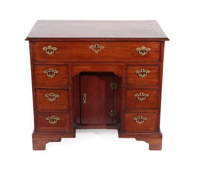 Lot 239 - A George III Mahogany Kneehole Desk, 3rd quarter 18th century, the moulded top above a long...