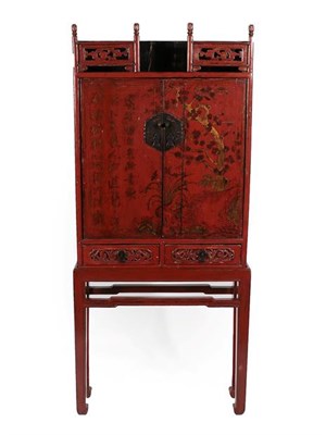Lot 246 - An 18th Century Chinese Red Lacquer Cabinet, the pierced trellis above two cupboard doors...