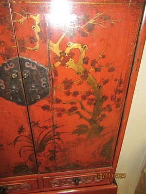 Lot 246 - An 18th Century Chinese Red Lacquer Cabinet, the pierced trellis above two cupboard doors...