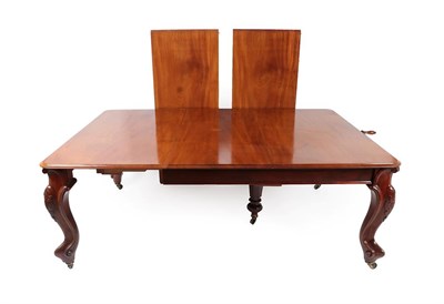Lot 261 - A Victorian Carved Mahogany Wind-Out Dining Table, circa 1870, the three original leaves and a...