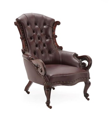 Lot 268 - A Victorian Carved Mahogany Armchair, circa 1870, recovered in dark red buttoned leather, the...