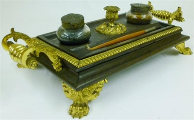 Lot 1078 - An Ebonised Wood and Gilt Brass Mounted Table Inkstandish, French, circa 1830, rectangular,...