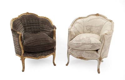 Lot 275 - A Pair of Louis XV Style Cream and Giltwood Bergères, one upholstered in grey foliate fabric, with