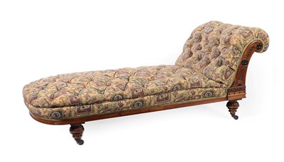 Lot 280 - An Aesthetic Walnut and Ebonised Day Bed, late 19th century, recovered in button floral fabric,...