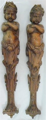 Lot 1087 - A Pair of Carved Oak Caryatid Wall Brackets, 19th century, as infants gazing downwards with...