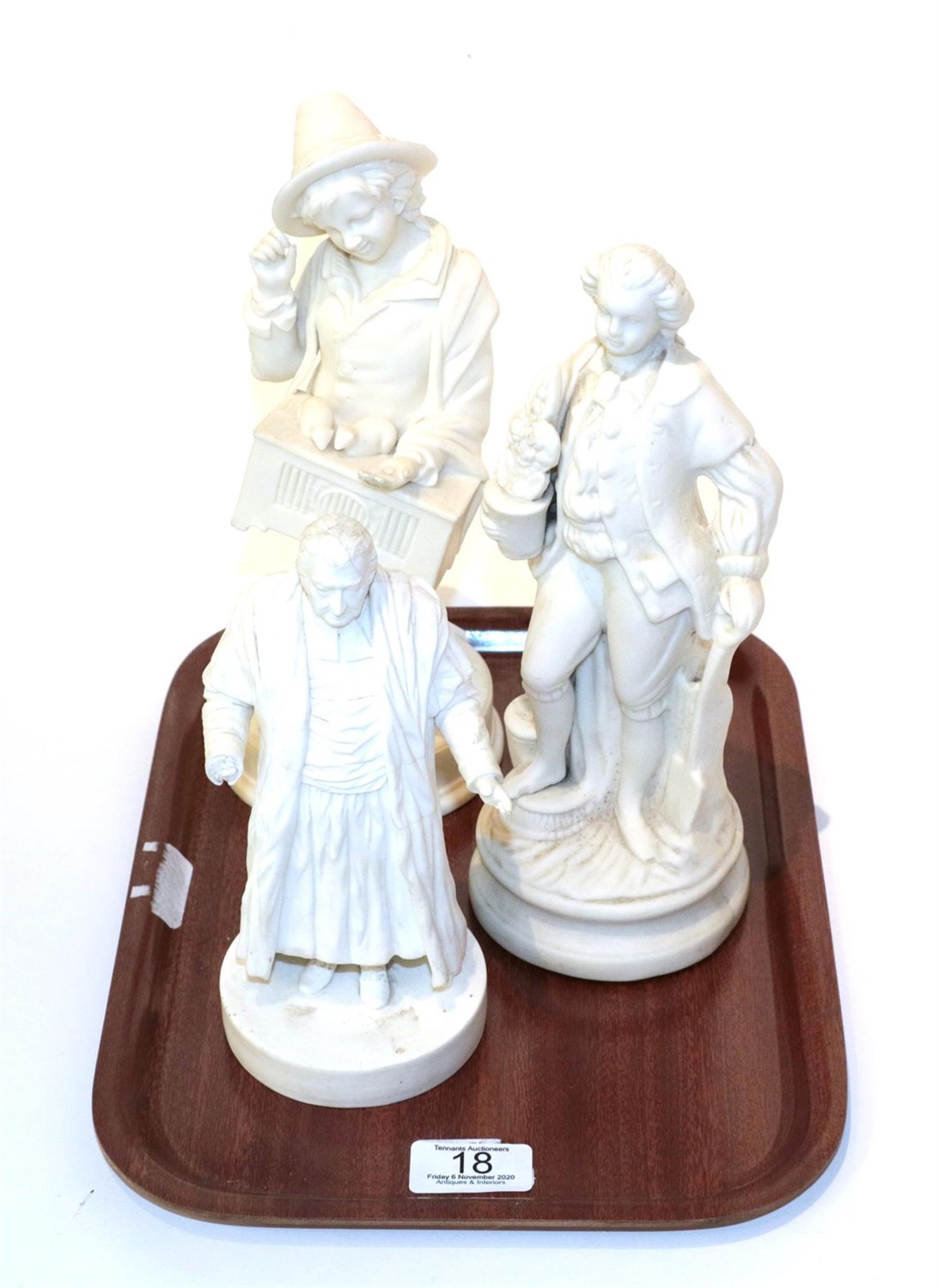 Lot 18 - Three Victorian Parian bisque porcelain figures comprising a gardener, Wesley and a peasant boy...