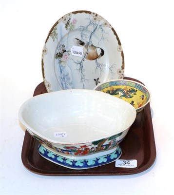 Lot 34 - A Chinese dragon bowl with another Chinese yellow ground tea bowl and a plate (3)