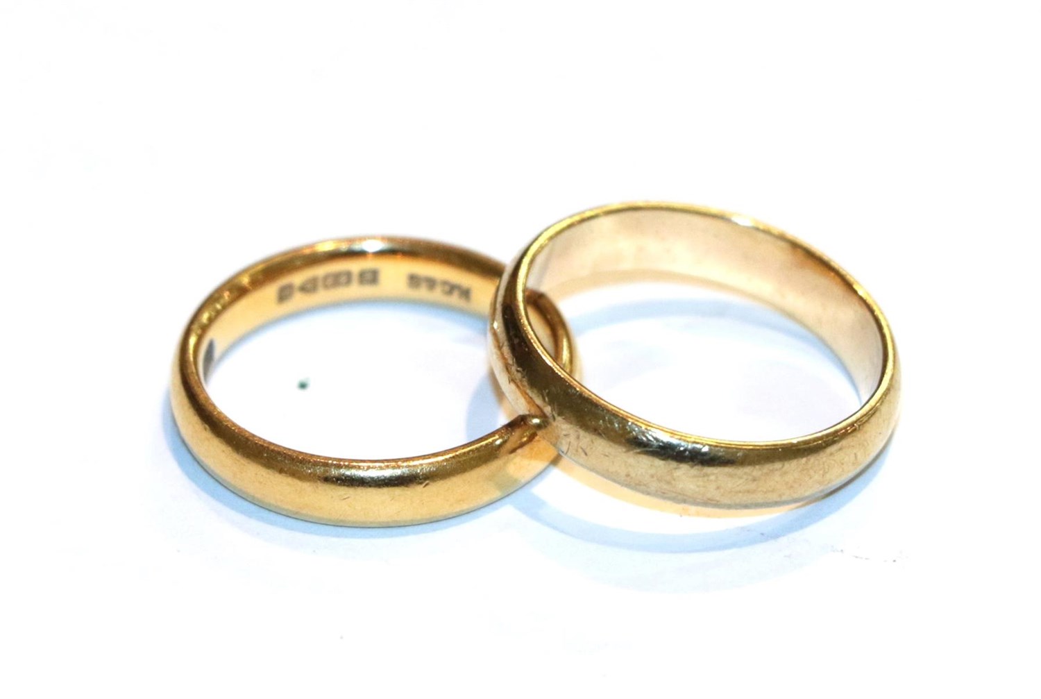 Lot 69 - A 22 carat gold band ring, finger size N and a 9 carat gold band ring, finger size P1/2