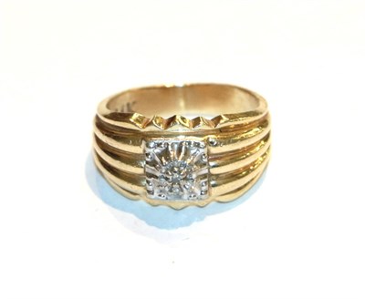 Lot 70 - A diamond cluster ring with grooved shoulders, stamped '14K', finger size N