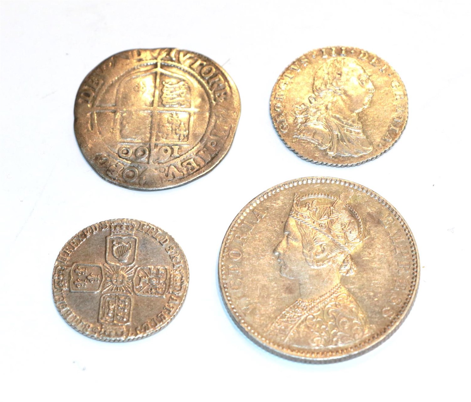 Lot 120 - A micellany of 4 x Silver Coins consisting of: Elizabeth I, 1600 Sixpence, mintmark 0. Bust 6c...