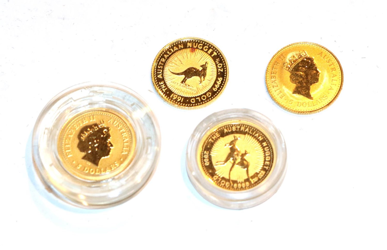 Lot 124 - 4 x Australia, $5, 1/20 oz .9999 Gold Coins featuring the 1990, 1991, 2000, and 2001 kangaroo...