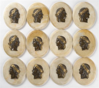 Lot 1109 - A Set of Twelve Italian Grand Tour Bronze Plaques Depicting Caesar Heads in Profile, on Marble...